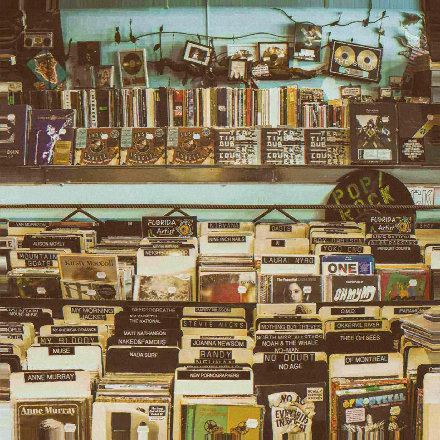 Worn artist tabs in a record shop.
