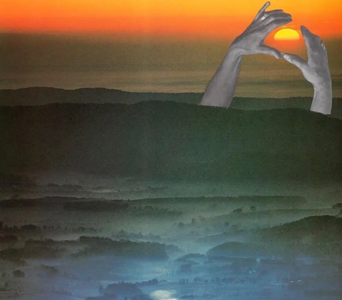 Hands framing a sunset over misty hills. Summer Madness